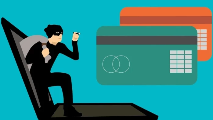 Dibujo de un ladrón saliendo de una computadora y de dos tarjetas de crédito